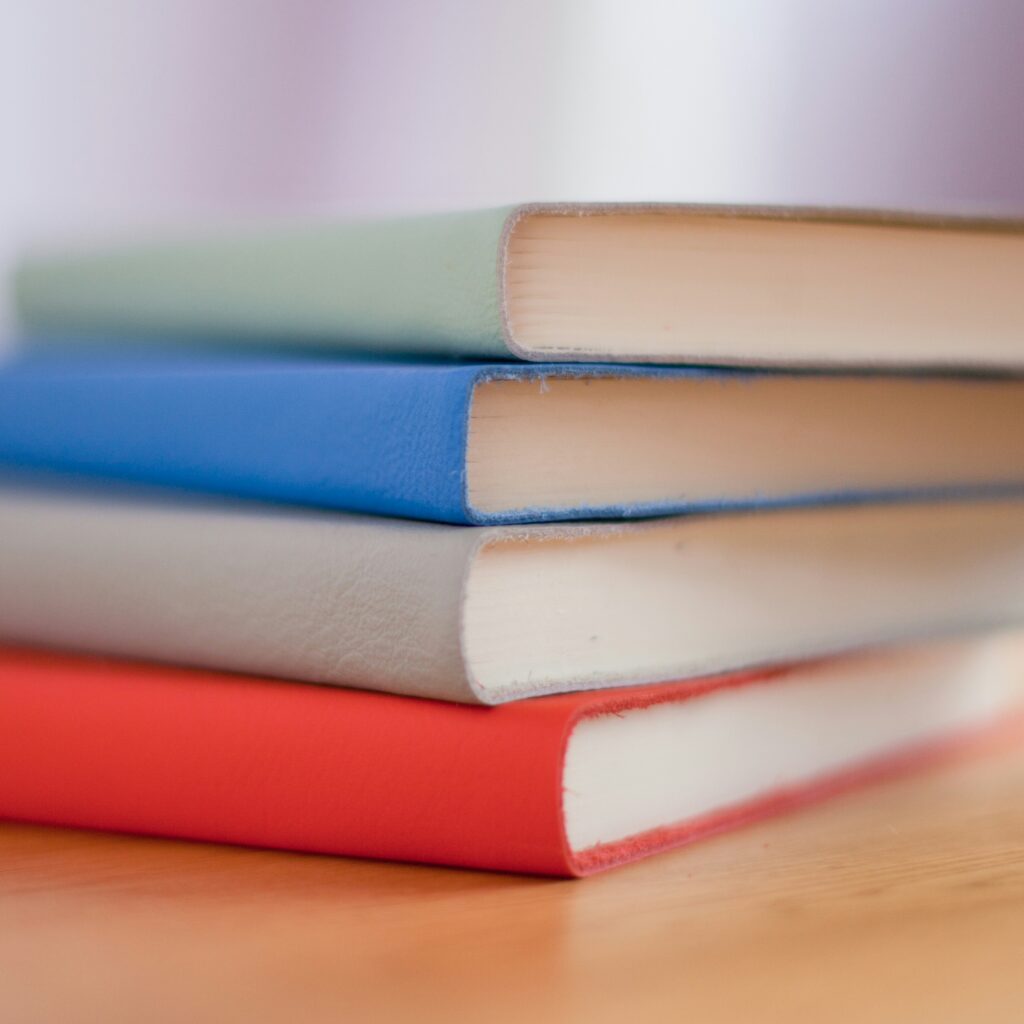 Circular picture of a stack of books.